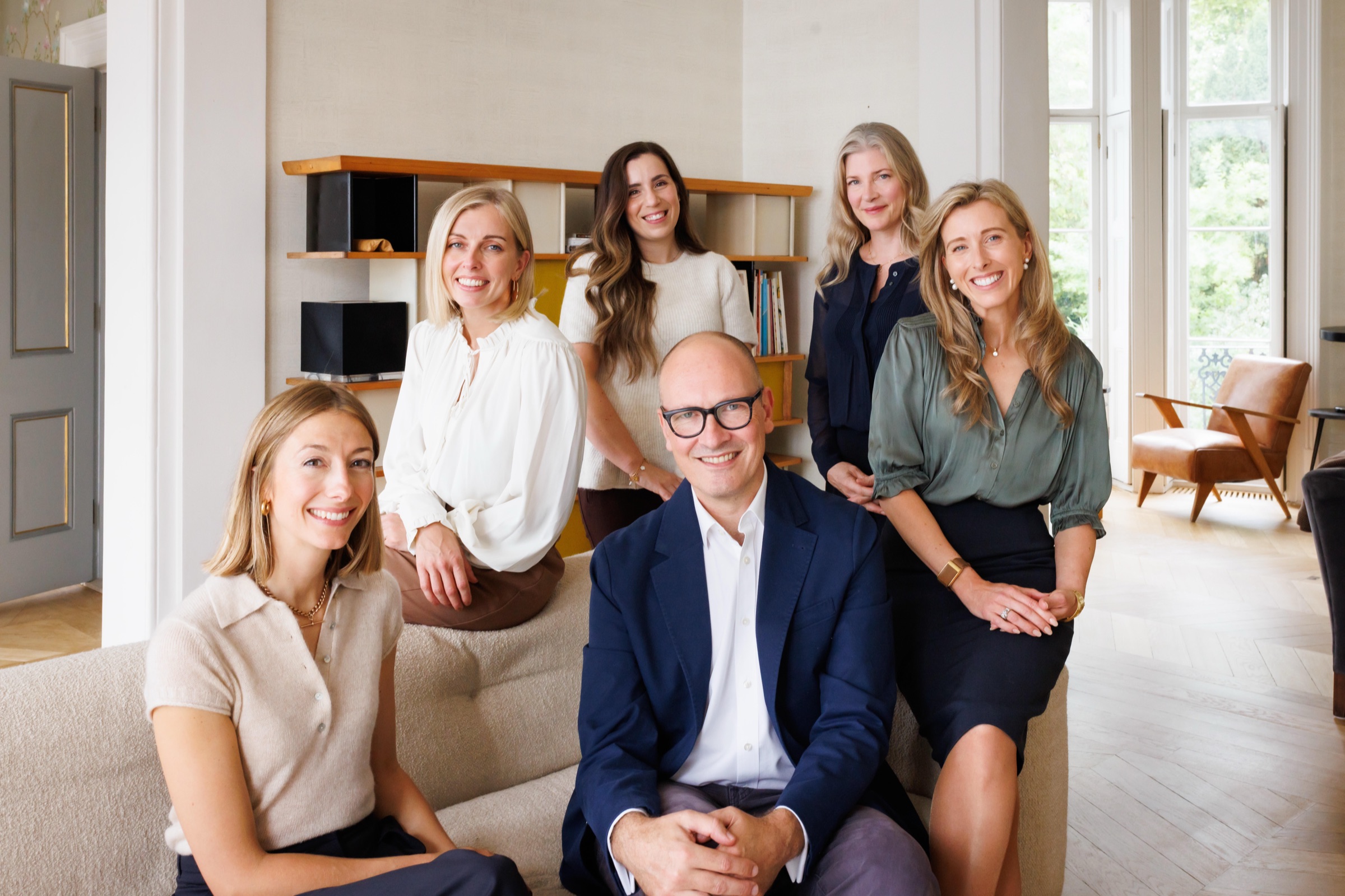 The Divorce Surgery team together in a bright, sunlit office